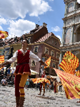 The photo shows a man with flags on the Old Market Square.