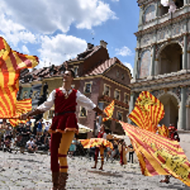 The photo shows a man with flags on the Old Market Square.