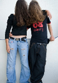 Picture of two people standing, with their long hair covering their faces
