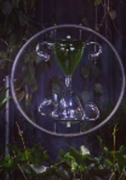 One of the works - a dark photo of an hourglass in a circle