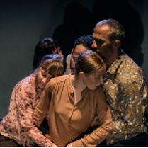 Photo of five people who are standing close to each other, but who do not look at each other