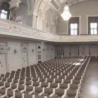 Black and white photo of rows of chairs in AMU Auditorium