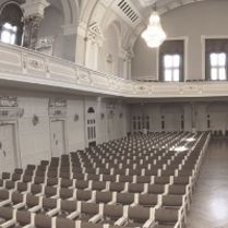 Black and white photo of rows of chairs in AMU Auditorium