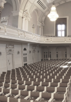 Black and white photo of rows of chairs in AMU Auditorium