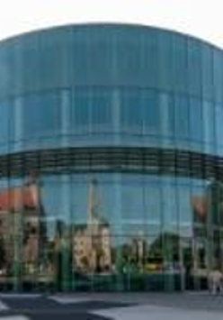 Photo of a round, glazed building.