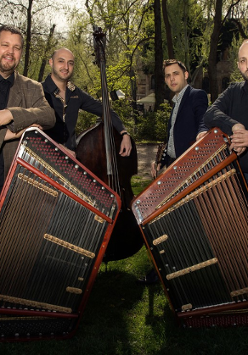 Photo of the band - four man standing by their musical instruments