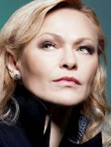 Photo of Edyta Geppert - a blond woman, who looks into the distance