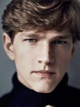 Photo of the artist - a face of a young man, who is looking straight into the camera