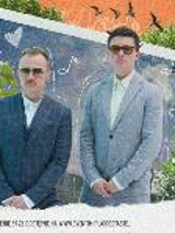 Picture of two men in suits and sun glasses - members of Karś/Rogucki band