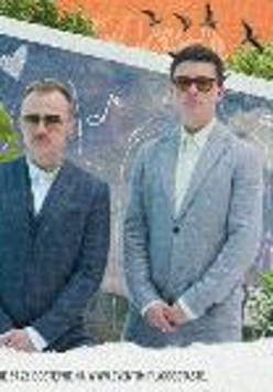 Picture of two men in suits and sun glasses - members of Karś/Rogucki band