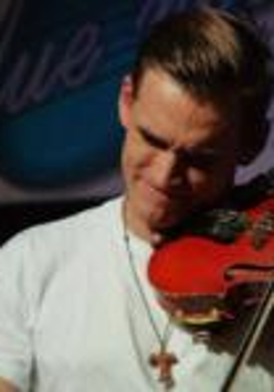 A man in a white T-shirt playing the violin