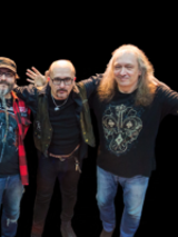 Photo of three men - members of the band