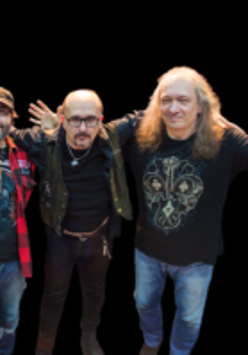 Photo of three men - members of the band