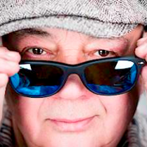 Photo of Stanisław Soyka's face with sunglasses on.