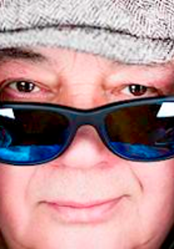 Photo of Stanisław Soyka's face with sunglasses on.