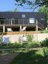 Picture of a building and the area in front of it with some deckchairs