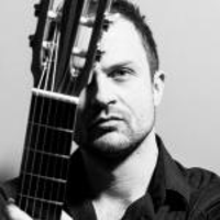 Black and white photo of the guitarist Krzysztof Meisinger