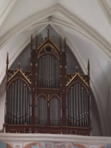 Photo of the pipe organ in a church.