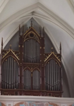 Photo of the pipe organ in a church.
