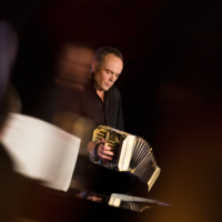 Photo of the musician playing the bandoneon