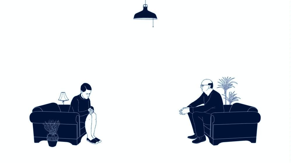 Frame from an animated film: a man and a woman sitting on their arm-chairs, opposite each other. A man is looking at a woman, a woman is gazing on the floor. The picture in dark blue and white colours.