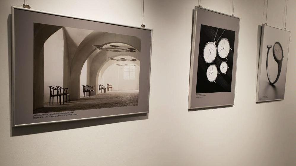 Black and white photo of three pictures hanging an the wall - the elements of the exhibition