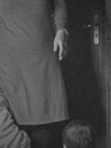 Black and white photo of a part of person in dress.