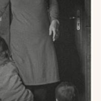 Black and white photo of a part of person in dress.