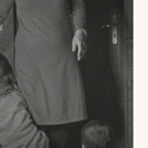 Black and white photo of a part of person in dress.