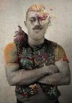 The picture of a man with folded arms in colourful vest. A part of his face is covered by flowers
