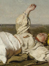 One of the pictures from the exhibition: a person in white garment lying on a ground and looking at the sky.