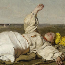 One of the pictures from the exhibition: a person in white garment lying on a ground and looking at the sky.