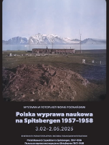 Exhibition poster. Square photograph of a landscape with a jagged rock in the foreground, a low wooden building in the background, and a strip of calm sea, mountains, and cloudless sky in the distance. Information about the exhibition below the photograph.