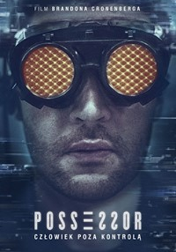 Dark photo of a man's face in yellow goggles
