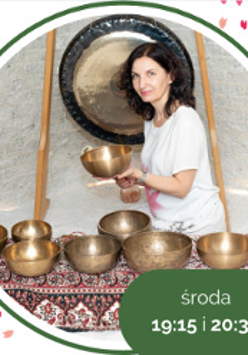 Photo of a woman holding a golden bowl. In front of her a few similar bowls.