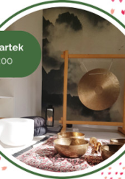 Photo of golden bowls and a golden gong in wooden frame.