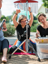 Photo of three women playing musical instruments.