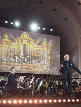 Photo of the orchestra performing on stage of AMU Auditorium