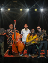 Photo of the band - six people holding their musical instruments