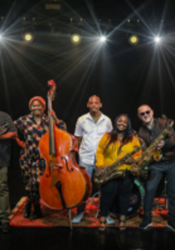 Photo of the band - six people holding their musical instruments