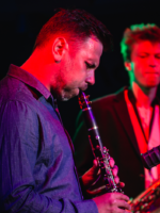 Picture of two musicians - one of them playing clarinet