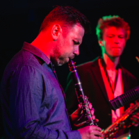 Picture of two musicians - one of them playing clarinet