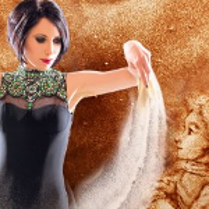 A picture presenting a woman spilling sand