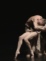 Photo from the performance - two dancers on stage in a dancing pose.