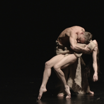 Photo from the performance - two dancers on stage in a dancing pose.