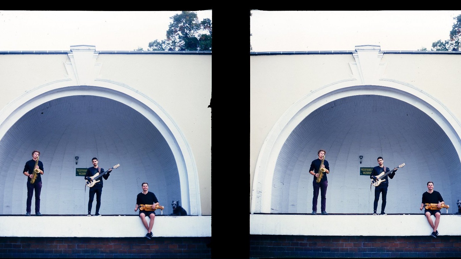 Stereoscopic photograph presenting three men playing instruments on bandshell stage; white background.