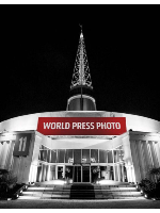 Exhibition poster - picture of the building where the exhibition takes place, the Spire at Poznań International Fair
