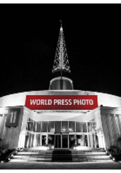 Exhibition poster - picture of the building where the exhibition takes place, the Spire at Poznań International Fair