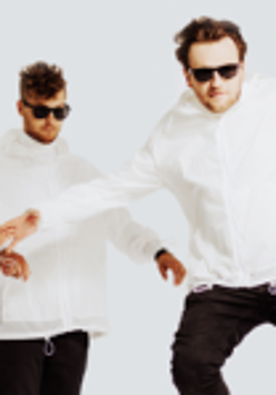 Photo of two men in white hoodies, black trousers and black sun-glasses with their arms outspread on white background