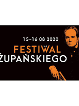 Po prawej Żupański w ciemnym ubraniuna czarnym tle. Na środku białe i pomarańczowe litery.